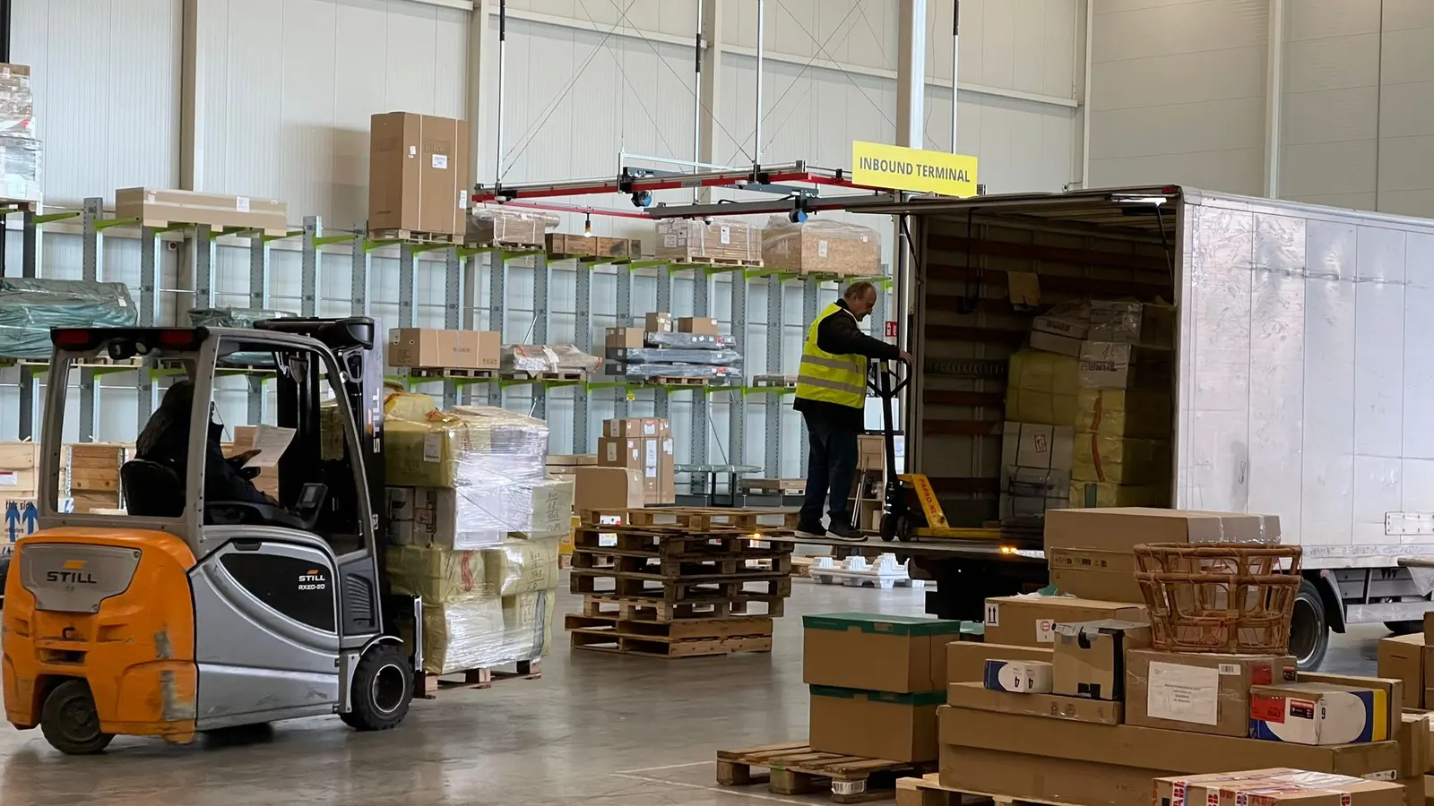Forklift and truck at the inbound terminal