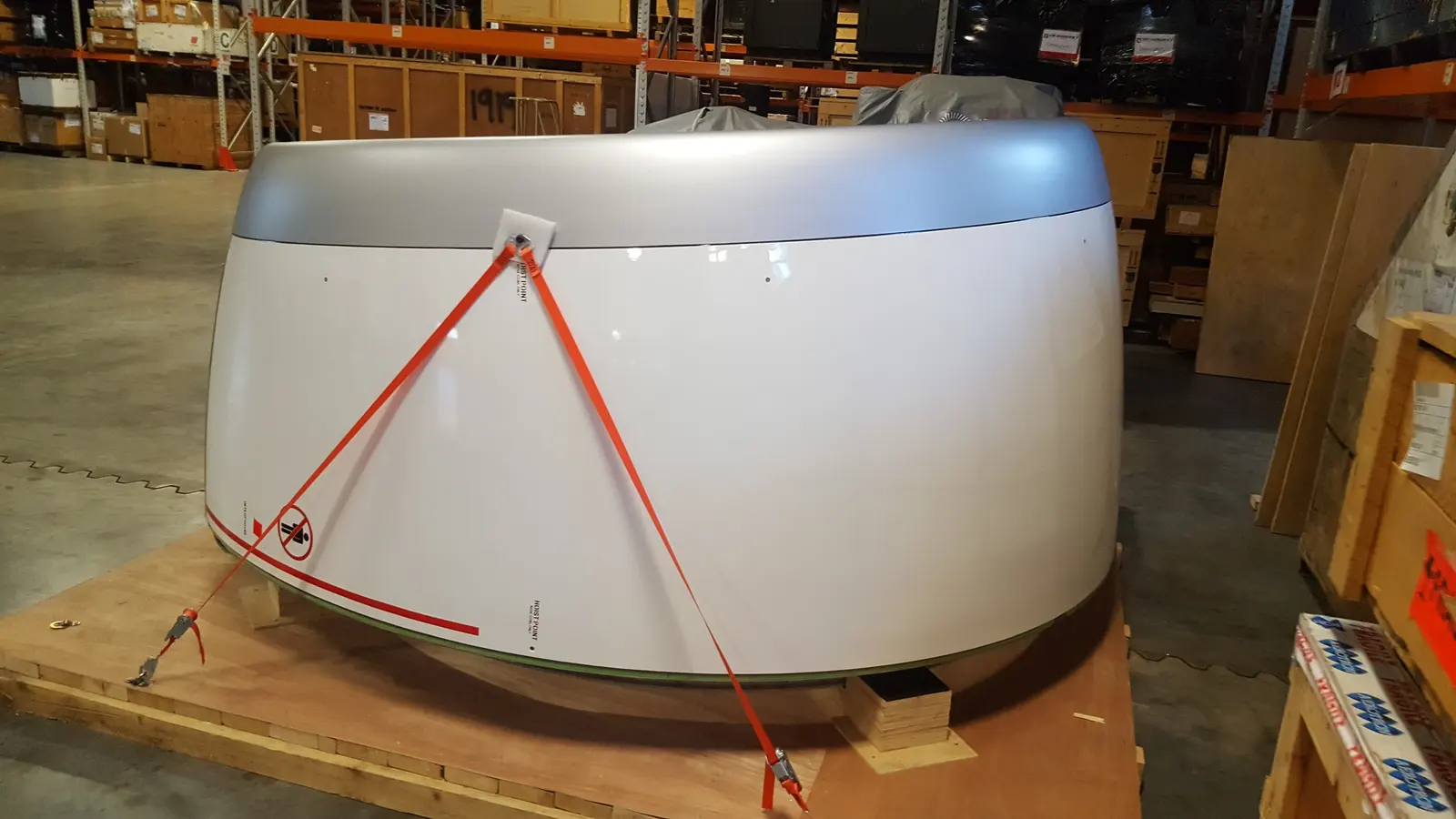 An oversized component strapped to a timber skid in the Reibel warehouse