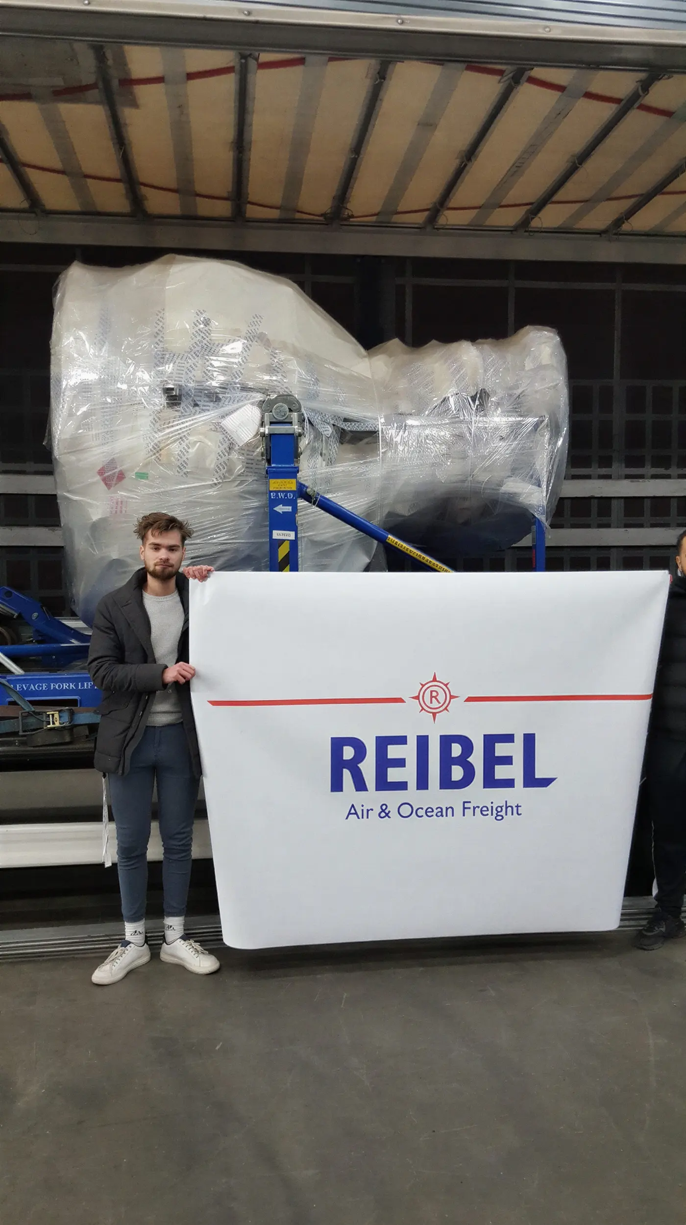 The Reibel team with a shrink-wrapped machine ready for dispatch